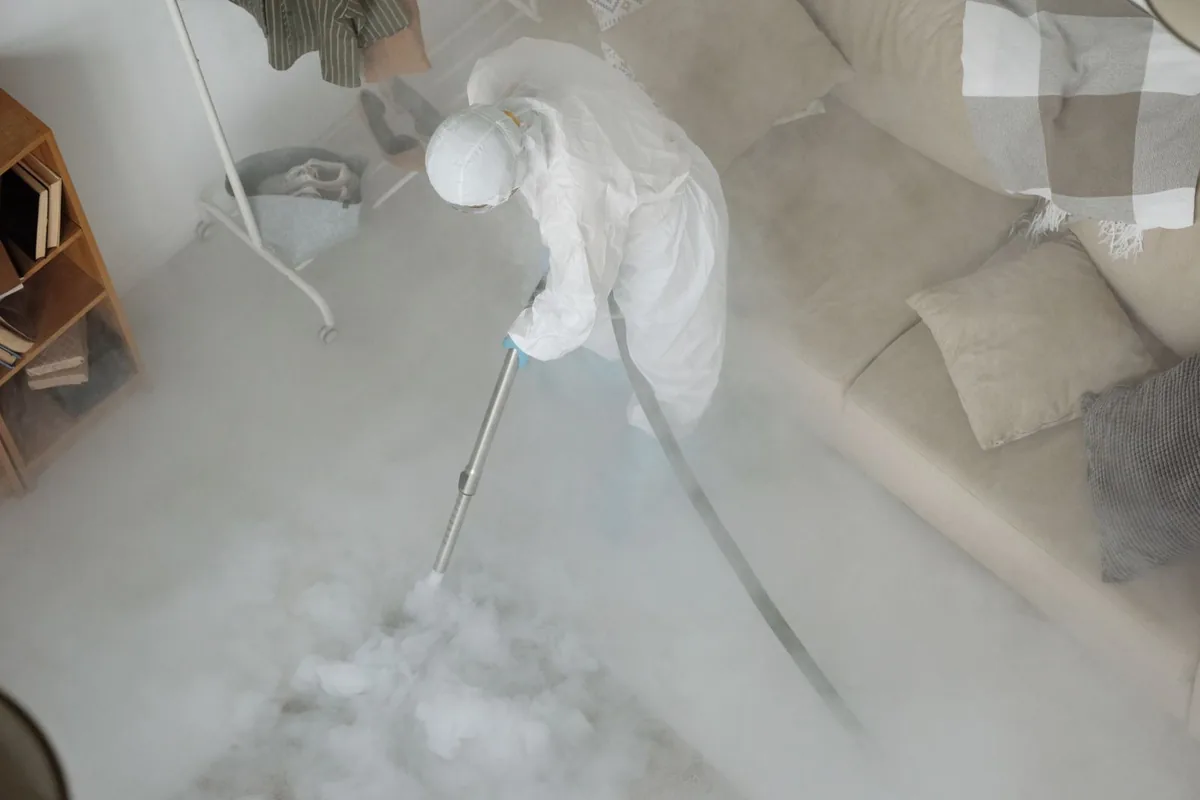 Biohazard cleanup technician in protective equipment, Walker, LA